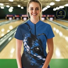 Load image into Gallery viewer, Female model shown from the front in a bowling venue wearing a blue and black quarter-zip shirt with butterfly and bowling-themed graphics.