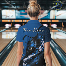 Load image into Gallery viewer, Back view of a female model at a bowling lane wearing a blue and black bowling quarter-zip shirt featuring a butterfly around a bowling ball.