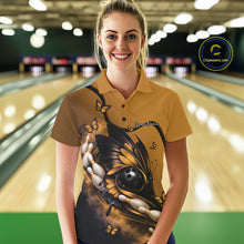 Load image into Gallery viewer, Female model wearing a yellow and black bowling polo shirt at a bowling lane with butterfly artwork, a bowling ball, and bowling pins.