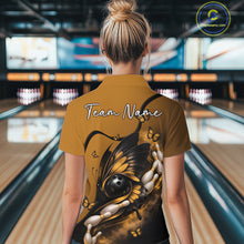 Load image into Gallery viewer, Back view of a female model at a bowling lane wearing a yellow and black bowling quarter-zip shirt featuring a butterfly wrapped around a bowling ball.