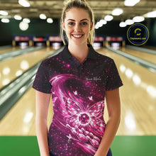 Load image into Gallery viewer, Female model wearing a pink bowling polo shirt in a bowling center with radiant butterfly wings and a bowling ball centerpiece.