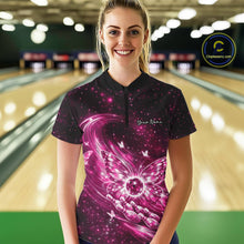 Load image into Gallery viewer, Female model shown from the front in a bowling center wearing a pink quarter-zip shirt with luminous butterfly wings and bowling ball graphics.