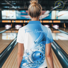 Load image into Gallery viewer, Back view of a women s white and blue bowling polo shirt displaying butterfly accents and bowling-themed graphics in a bowling venue.