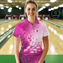 Load image into Gallery viewer, Female model wearing a white and pink bowling polo shirt with butterfly artwork and bowling-themed graphics at the bowling lane.