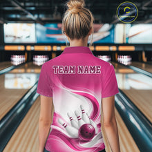 Load image into Gallery viewer, White and pink bowling quarter-zip worn by a female model, featuring fluid wave accents and a bowling ball knocking down pins