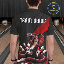Load image into Gallery viewer, Back view of a black mens bowling polo showcasing a red cobra wrapped around a bowling ball with scattered pins.