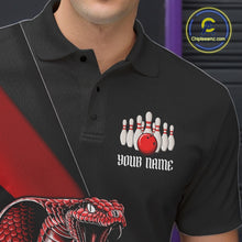 Load image into Gallery viewer, Close-up left chest graphic on a black bowling polo featuring a red cobra and bowling ball motif.