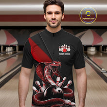 Load image into Gallery viewer, Male model at the bowling lane wearing a black quarter-zip with red cobra artwork and bowling-themed graphics.