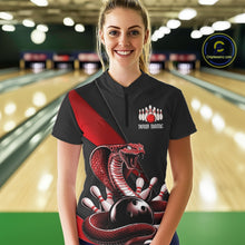Load image into Gallery viewer, Female model wearing a black bowling quarter-zip in a bowling alley with red cobra artwork and bowling-themed graphics.