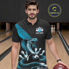 Load image into Gallery viewer, Male model wearing a black bowling polo in a bowling center with blue cobra artwork and bowling-themed accents.