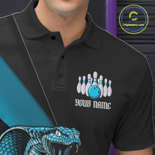 Load image into Gallery viewer, Left chest close-up of a black bowling polo featuring a blue cobra, bowling ball, and pin artwork.