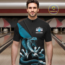 Load image into Gallery viewer, Male model wearing a black quarter-zip in a bowling lane with blue cobra artwork and bowling graphics.