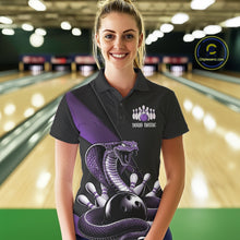 Load image into Gallery viewer, Female model wearing a black bowling polo at the bowling lane with purple cobra artwork and bowling pins.