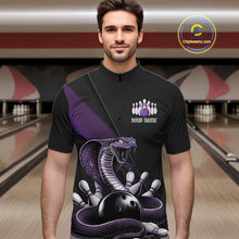 Load image into Gallery viewer, Male model in a bowling center wearing a black quarter-zip with purple cobra artwork and bowling pin details.