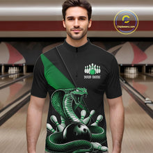 Load image into Gallery viewer, Male model wearing a black quarter-zip at the bowling lane with green cobra artwork and bowling-themed accents.