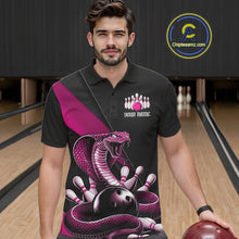 Load image into Gallery viewer, Male model in a bowling center wearing a black bowling polo with pink cobra artwork and bowling pin accents.