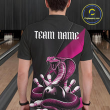 Load image into Gallery viewer, Back view of a black mens bowling polo showcasing a pink cobra wrapped around a bowling ball with scattered pins.