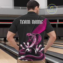 Load image into Gallery viewer, Front view of a black mens bowling quarter-zip showcasing a pink cobra, bowling ball, and scattered pin graphics.