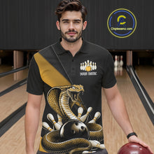 Load image into Gallery viewer, Male model wearing a black bowling polo at the bowling lane with yellow cobra artwork and scattered pin graphics.