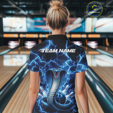Load image into Gallery viewer, Back view of a womens bowling polo displaying a blue cobra around a bowling ball with lightning accents.