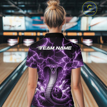 Load image into Gallery viewer, Back view of a womens bowling polo displaying a purple cobra wrapped around a bowling ball with lightning accents.