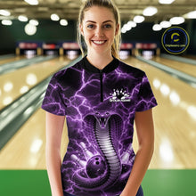 Load image into Gallery viewer, Female model at a bowling alley wearing a quarter-zip with a purple cobra wrapped around a bowling ball against lightning effects.