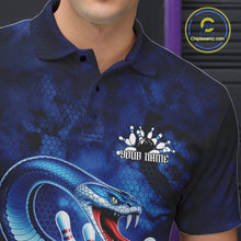 Load image into Gallery viewer, Close-up of the left chest on a bowling polo featuring a blue cobra coiled around a bowling ball with scattered pin graphics.