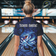 Load image into Gallery viewer, Back view of a womens bowling polo showcasing a blue cobra wrapped around a bowling ball with dark fantasy accents.