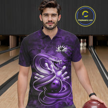 Load image into Gallery viewer, Male model wearing a bowling polo at the bowling lane with purple cobra artwork wrapped around a bowling ball.
