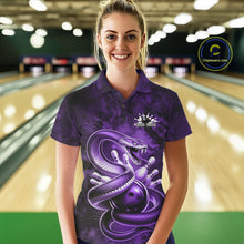 Load image into Gallery viewer, Female model wearing a bowling polo in a bowling lane with purple cobra artwork wrapped around a bowling ball.