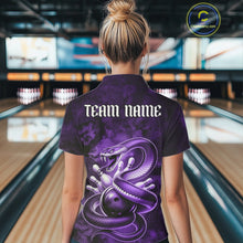 Load image into Gallery viewer, Back view of a womens bowling polo showcasing a purple cobra, bowling ball, and scattered pins in dark fantasy styling.