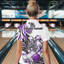Load image into Gallery viewer, Back view of a female model wearing a white bowling polo shirt with purple and black tribal artwork, scale-inspired textures, and a glossy red bowling ball striking pins
