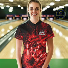 Load image into Gallery viewer, Female model wearing a black and red bowling quarter-zip in a bowling alley with fiery bowling graphics and patriotic background details.