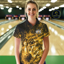 Load image into Gallery viewer, Female model in a bowling center wearing a black and yellow polo decorated with fiery patriotic bowling artwork.