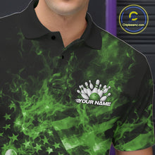 Load image into Gallery viewer, Close-up left chest detail of a black and green bowling polo featuring a flaming bowling ball and patriotic pin artwork.
