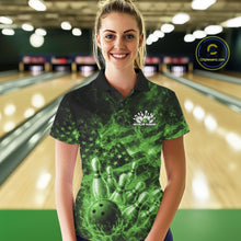 Load image into Gallery viewer, Female model wearing a black and green bowling polo in a bowling lane with fiery bowling strike artwork and patriotic accents.