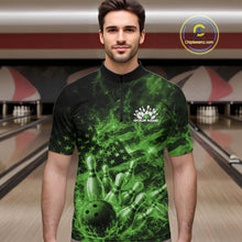 Load image into Gallery viewer, Male model wearing a black and green bowling quarter-zip in a bowling lane with fiery bowling strike artwork and patriotic accents.