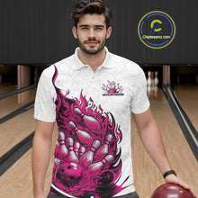 Load image into Gallery viewer, Male model wearing a white and pink bowling polo in a bowling lane featuring a flaming bowling ball crashing into pins with fiery artwork.