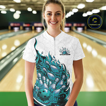 Load image into Gallery viewer, Front view female model at bowling lane wearing white and turquoise blue quarter zip shirt showing flaming bowling ball crashing into pins with vivid fire illustration.
