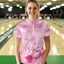 Load image into Gallery viewer, Female model in a bowling lane wearing a pink quarter zip shirt with butterfly and diamond sparkle bowling graphics.