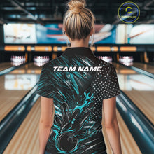 Load image into Gallery viewer, Female model at a bowling lane, back view of black and turquoise blue quarter zip shirt showcasing patriotic flames bowling ball striking pins with American flag inspired graphics