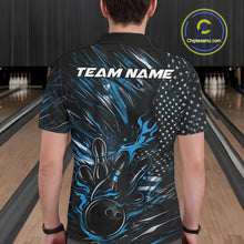 Load image into Gallery viewer, Back view of a male model in a bowling alley wearing a black and blue polo shirt featuring a flaming bowling ball and pin motif.