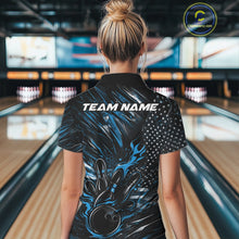 Load image into Gallery viewer, Female model at a bowling lane, back view of black and blue quarter zip shirt showcasing patriotic flames bowling ball striking pins with American flag styling