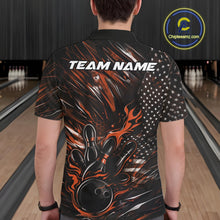 Load image into Gallery viewer, Back view of a male model in a bowling venue wearing a black and orange polo shirt featuring a patriotic bowling strike motif.