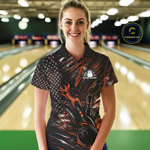 Load image into Gallery viewer, Female model wearing a black and orange bowling polo shirt at a bowling lane with fiery bowling strike graphics and American flag styling.