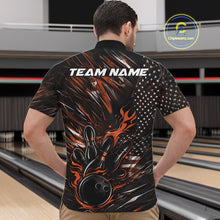 Load image into Gallery viewer, Front view of a male model in a bowling venue wearing a black and orange quarter-zip shirt featuring a flaming bowling ball knocking down pins.