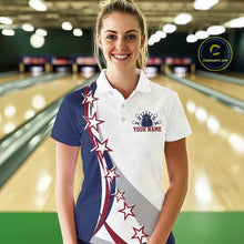 Load image into Gallery viewer, Front view of a female model in a bowling lane wearing a red, white, and blue polo shirt with bowling artwork, sweeping stars, and stripes.