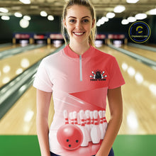Load image into Gallery viewer, Front view of a female model at the bowling lane wearing a quarter zip shirt with bowling ball and pins arranged in a pink gradient layout.