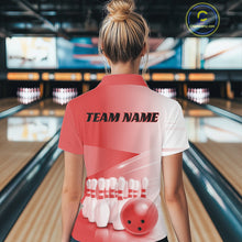 Load image into Gallery viewer, Female model back view in a bowling lane wearing a quarter zip shirt with bowling ball and pins arranged through a pink gradient design.