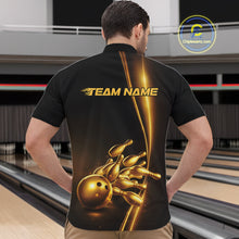 Load image into Gallery viewer, Front view of a male model in a bowling lane wearing a black quarter-zip shirt featuring golden bowling ball and pins design with sleek sporty styling.